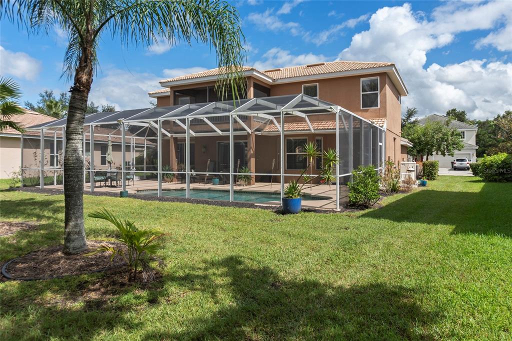 8746 Stone Harbour Loop Bradenton, FL 34212 - Photo 49 of 71 a front view of a house with a yard