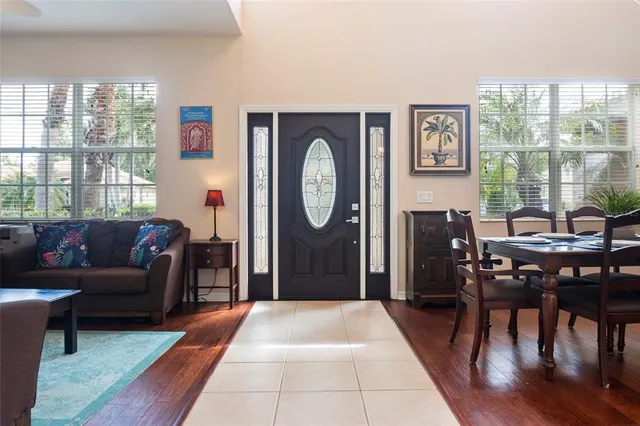 a view of a dining room with furniture window and wooden floor