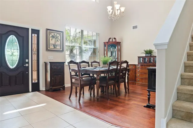 a view of a dining room with furniture window and outside view