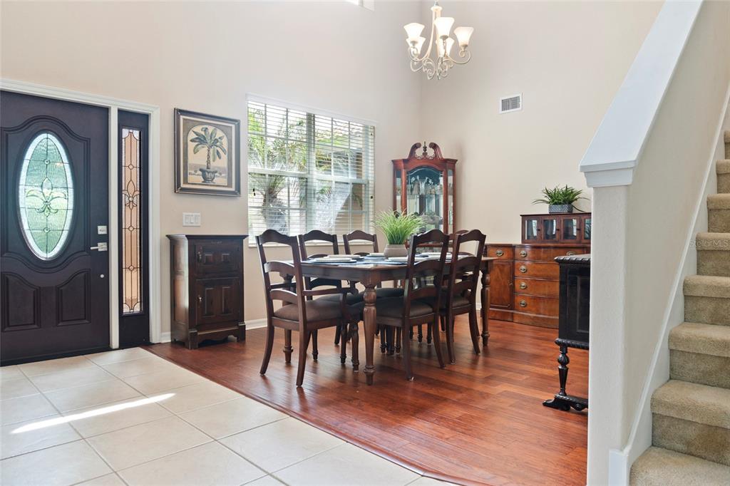 8746 Stone Harbour Loop Bradenton, FL 34212 - Photo 6 of 71 a view of a dining room with furniture window and wooden floor