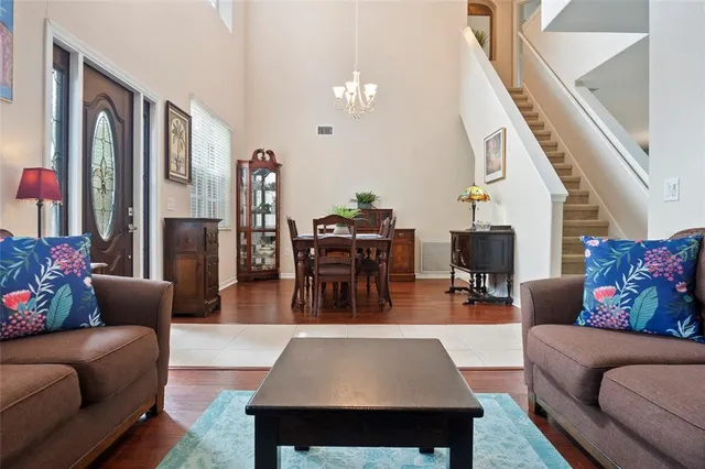 a living room with furniture and a rug