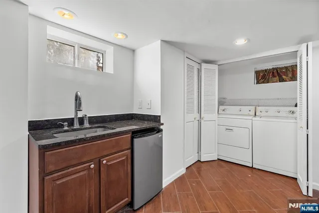 a kitchen with a sink cabinets and window