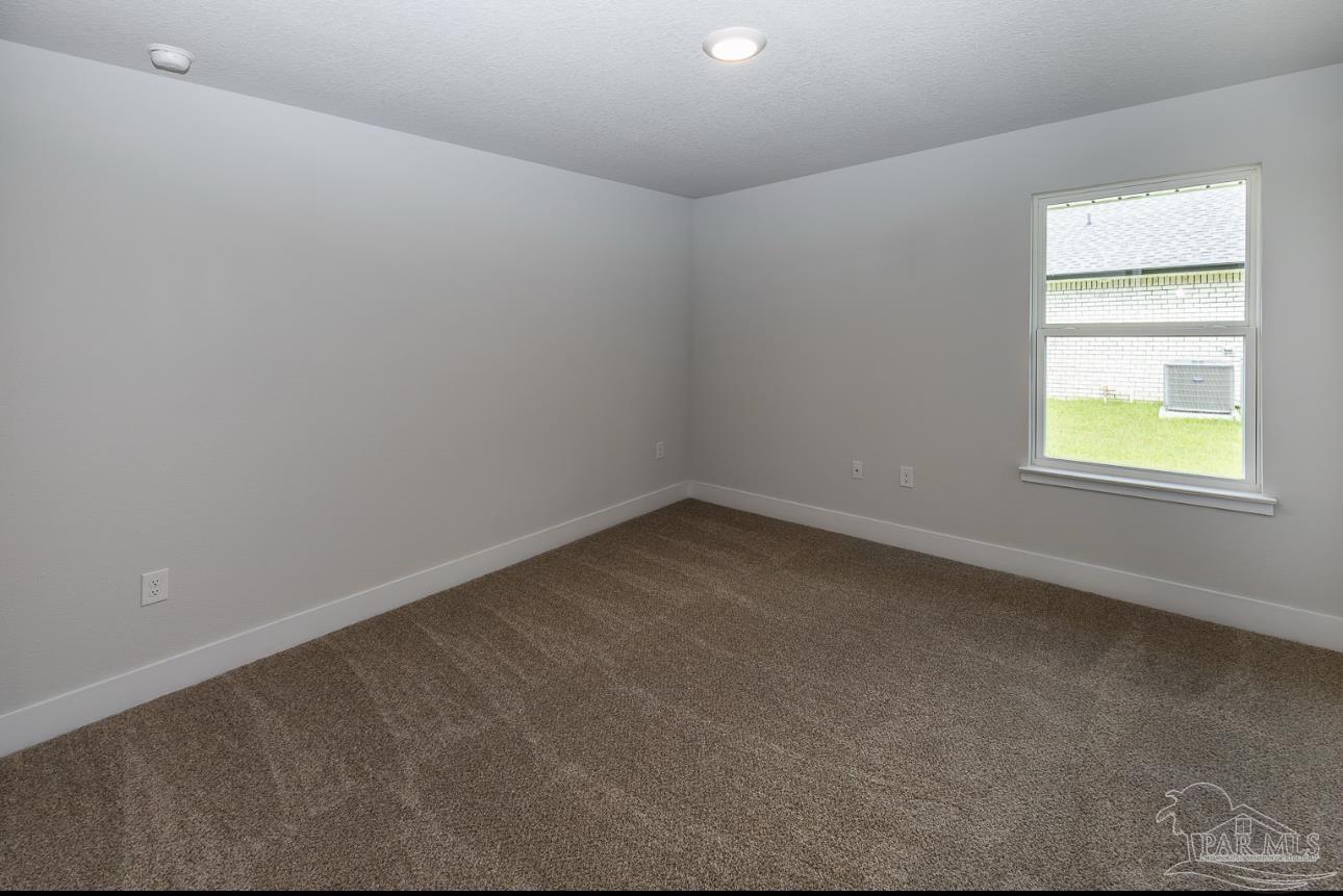5303 Zenith Lane Milton, FL 32583 - Photo 13 of 16 an empty room with a window