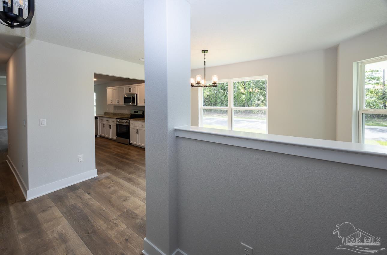 5303 Zenith Lane Milton, FL 32583 - Photo 6 of 16 a view of a kitchen from the hallway
