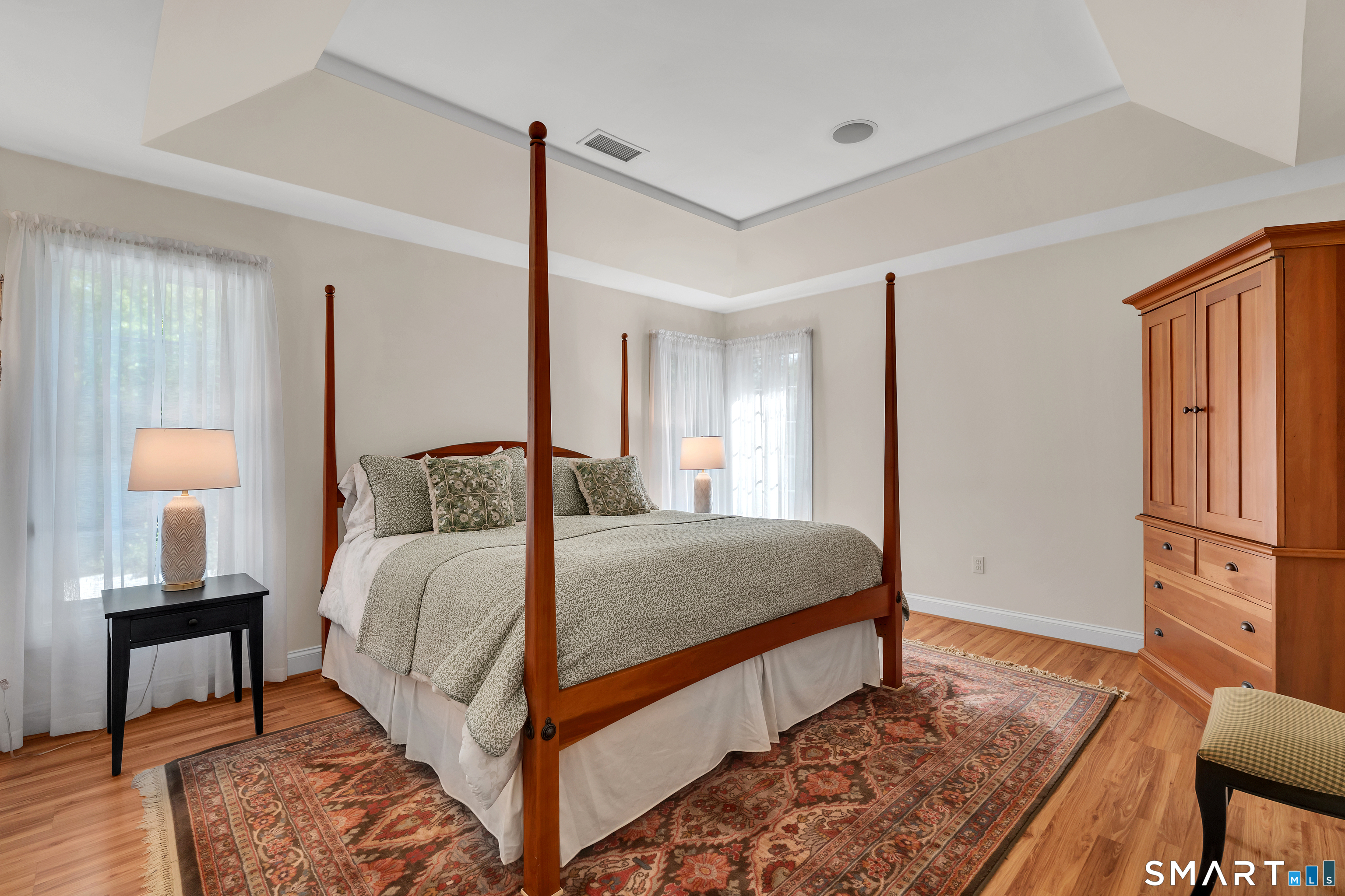 21 Stone Wall Road Salem, CT 06420 - Photo 20 of 38 a bedroom with a bed lamps and a dresser