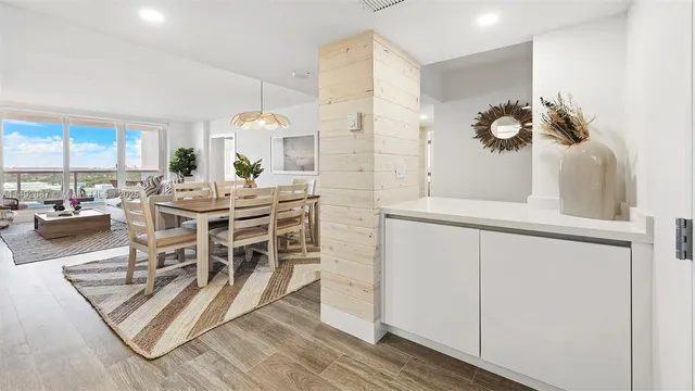 a view of a dining room with furniture and a window