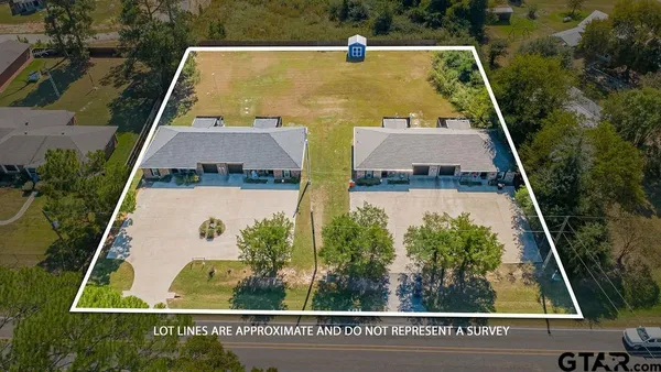 an aerial view of residential house with pool and yard