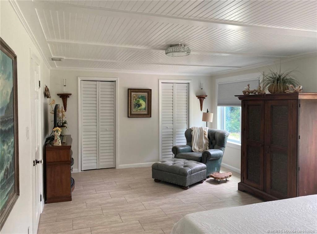 4621 Southeast Shady Ridge Lane Stuart, FL 34997 - Photo 8 of 11 a living room with furniture and a window