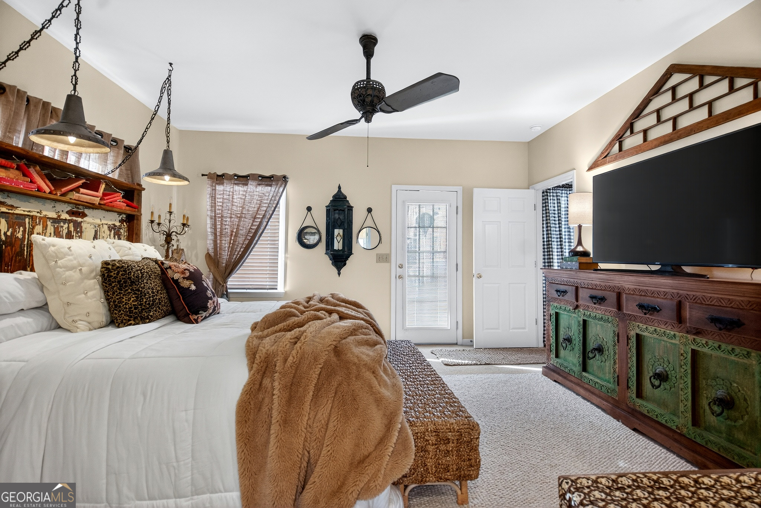 123 South Smith Road LaGrange, GA 30241 - Photo 17 of 67 a bedroom with a bed and a flat tv screen on the dresser