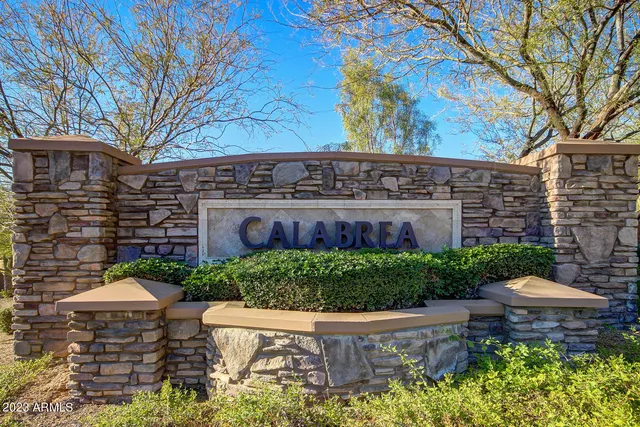 a view of a large building with a yard