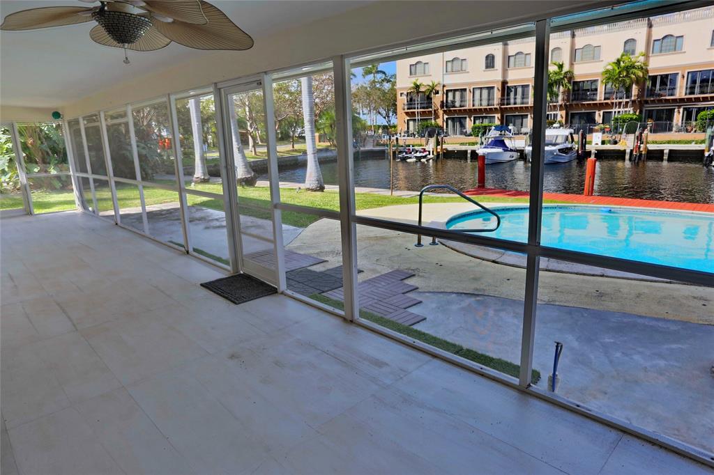 100 Circle Drive Pompano Beach, FL 33062 - Photo 22 of 30 a view of a living room and balcony