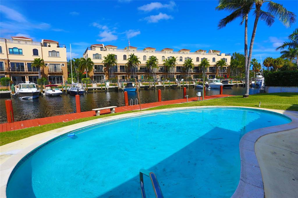 100 Circle Drive Pompano Beach, FL 33062 - Photo 25 of 30 a view of swimming pool with outdoor seating
