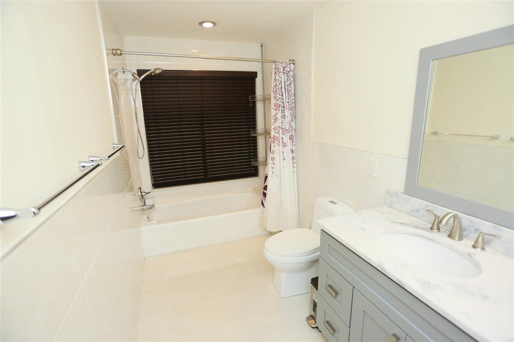 100 Circle Drive Pompano Beach, FL 33062 - Photo 10 of 30 a bathroom with a granite countertop sink toilet and shower