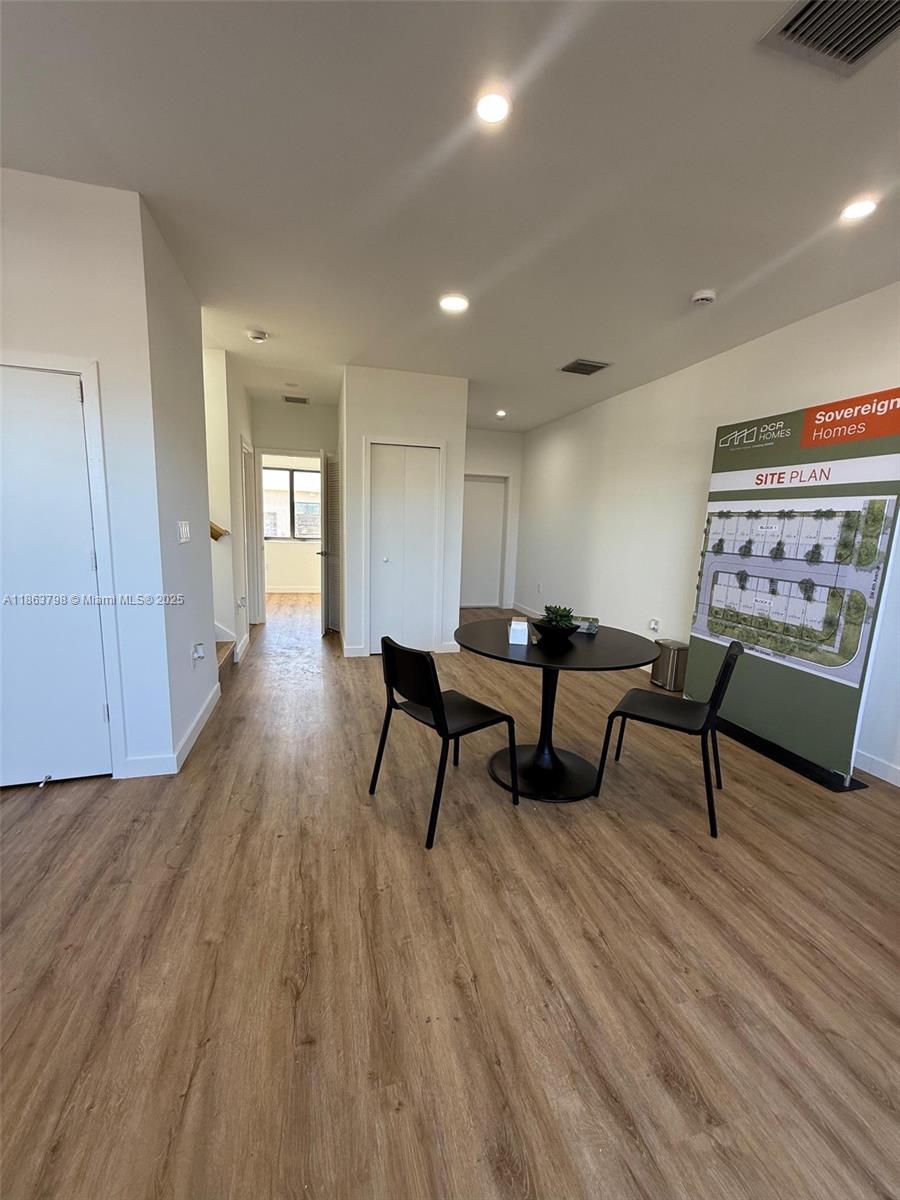 416 Southwest 1st Street, Unit 416 Florida City, FL 33034 - Photo 13 of 24 a living room with furniture and a wooden floor