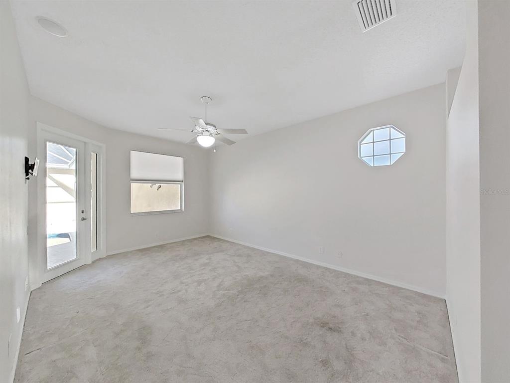14595 Oliver Street Largo, FL 33774 - Photo 14 of 35 an empty room with a window