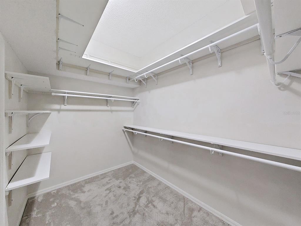 14595 Oliver Street Largo, FL 33774 - Photo 19 of 35 a view of an empty walk in closet