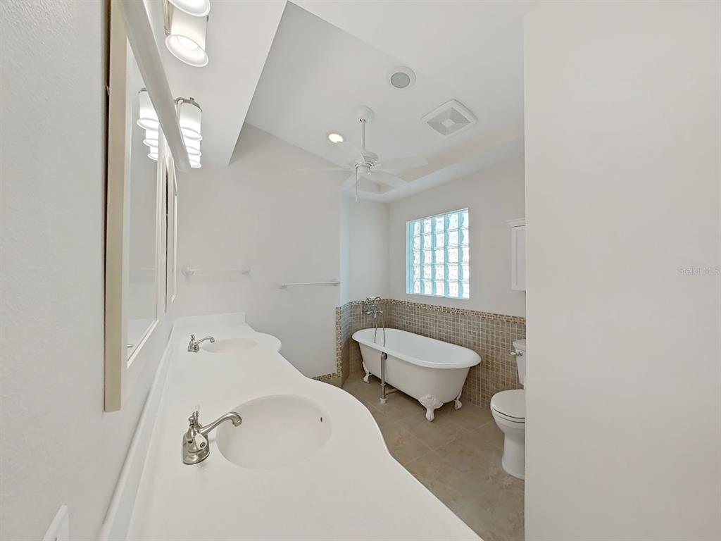 14595 Oliver Street Largo, FL 33774 - Photo 20 of 35 a bathroom with a sink and a mirror