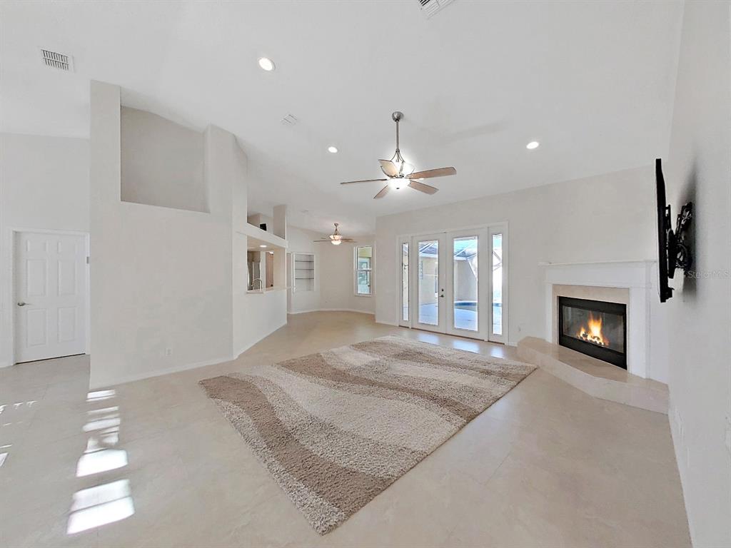 14595 Oliver Street Largo, FL 33774 - Photo 6 of 35 a view of an empty room and fire place