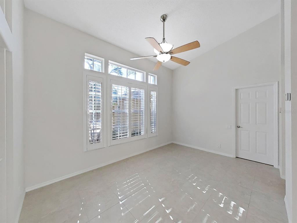 14595 Oliver Street Largo, FL 33774 - Photo 9 of 35 a view of an empty room with a window