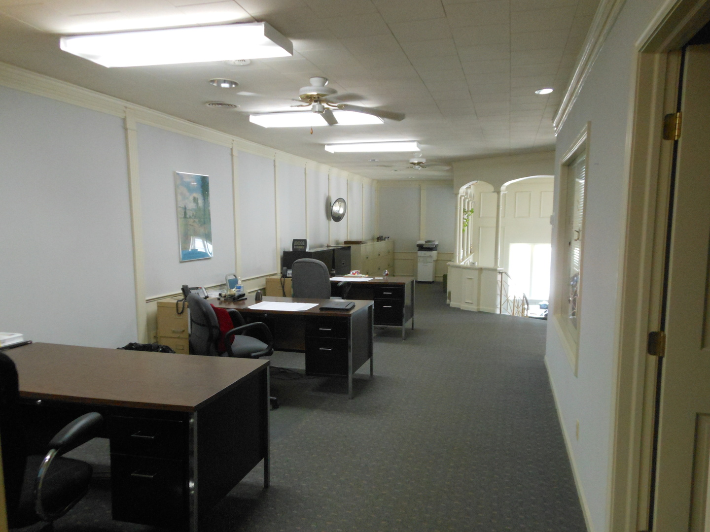 918 Plainfield Road Joliet, IL 60435 - Photo 8 of 12 a living room with furniture a chandelier and a dining table