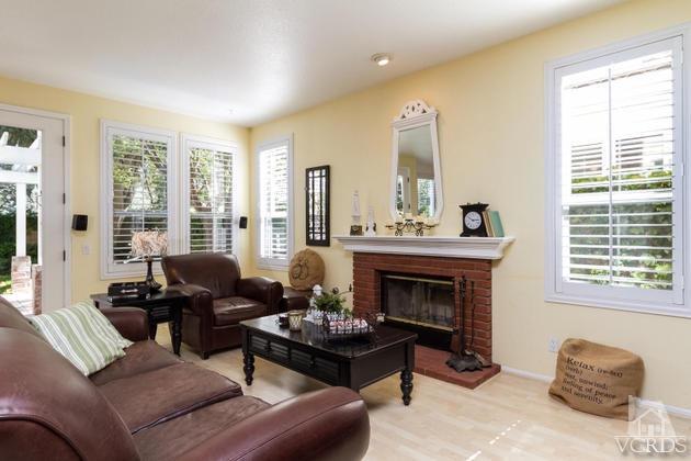 4349 Clearwood Road Moorpark, CA 93021 - Photo 11 of 35 a living room with furniture and a fireplace