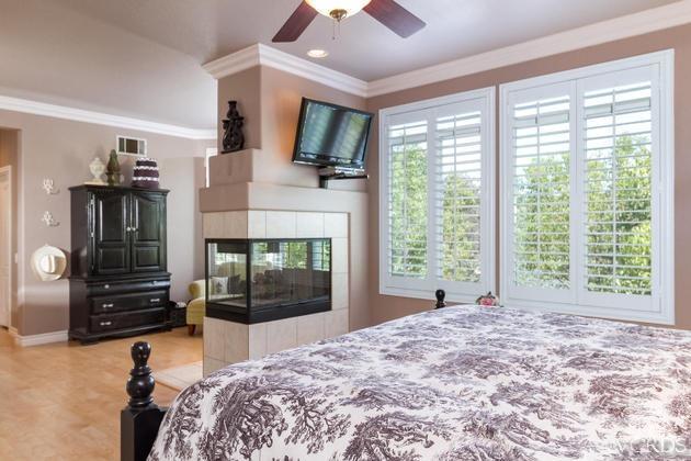 4349 Clearwood Road Moorpark, CA 93021 - Photo 14 of 35 a bed room with a bed and a television