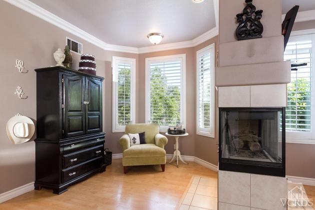 4349 Clearwood Road Moorpark, CA 93021 - Photo 15 of 35 a living room with furniture and a fireplace