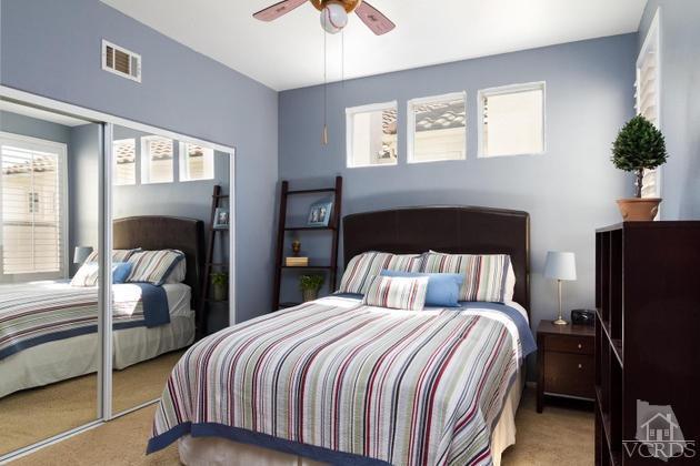 4349 Clearwood Road Moorpark, CA 93021 - Photo 18 of 35 a bedroom with a bed and a potted plant on dresser