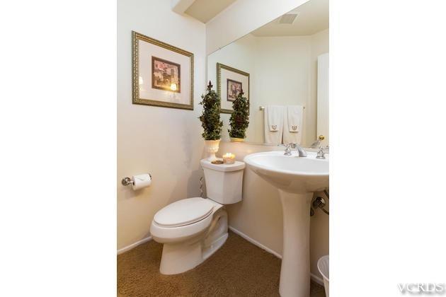 4349 Clearwood Road Moorpark, CA 93021 - Photo 23 of 35 a bathroom with a toilet a sink and mirror
