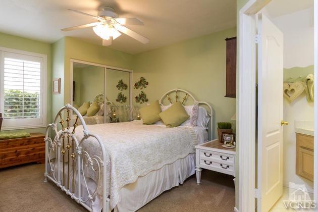 4349 Clearwood Road Moorpark, CA 93021 - Photo 24 of 35 a bedroom with a bed and a chandelier