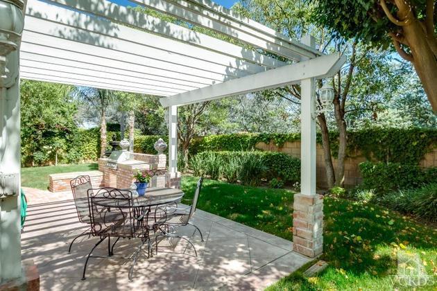 4349 Clearwood Road Moorpark, CA 93021 - Photo 29 of 35 a view of a patio with table and chairs and potted plants