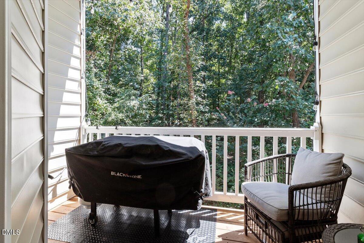 6224 Braidwood Court Raleigh, NC 27612 - Photo 11 of 39 a view of a chair in wooden deck
