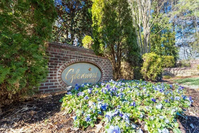 a front view of a house with lots of plants