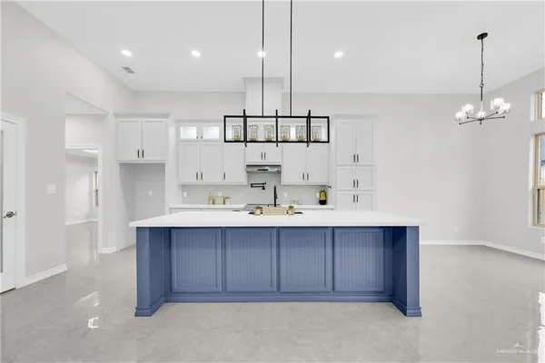 a view of kitchen and kitchen island