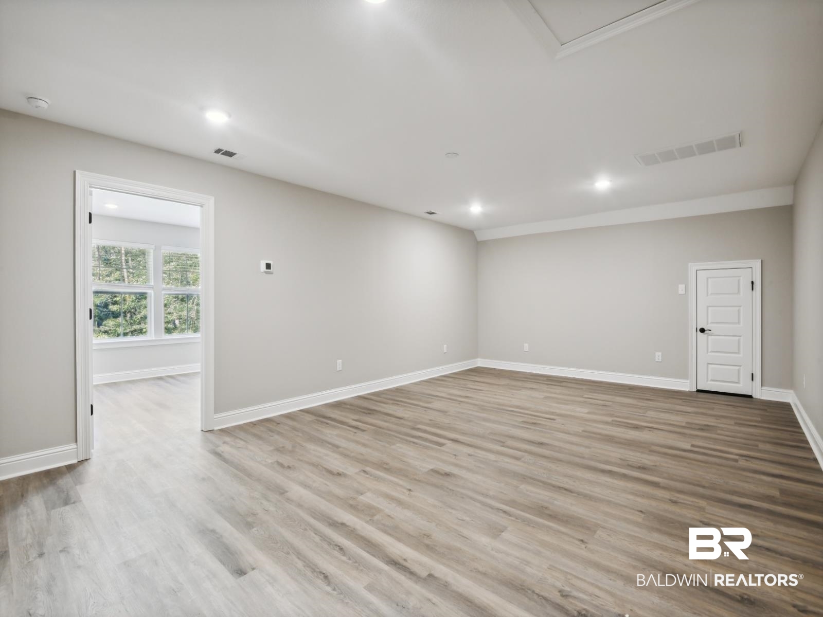 23937 Peppermint Street Elberta, AL 36530 - Photo 17 of 22 Empty room featuring light wood-style floors and recessed lighting