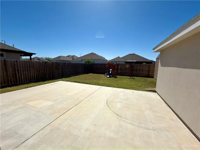 a view of a backyard of a house