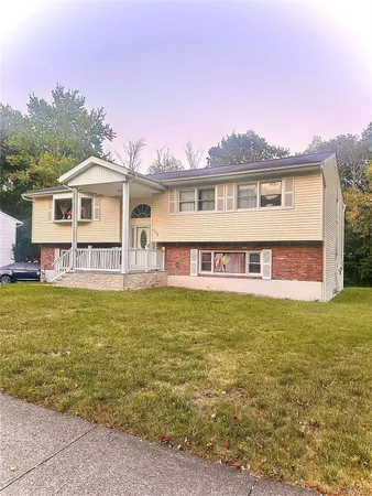 a view of a house with a swimming pool and a yard