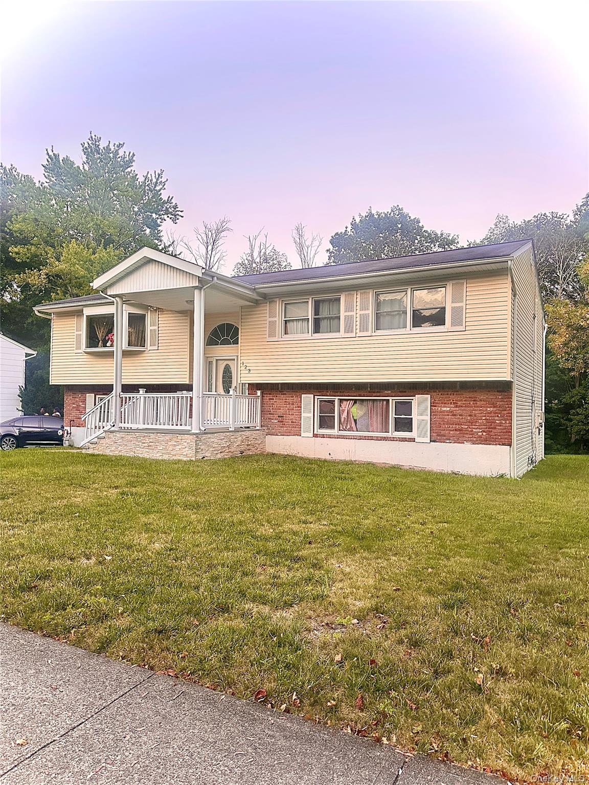 123 Rockland Lane Spring Valley, NY 10977 - Photo 2 of 2 a view of a house with a swimming pool and a yard