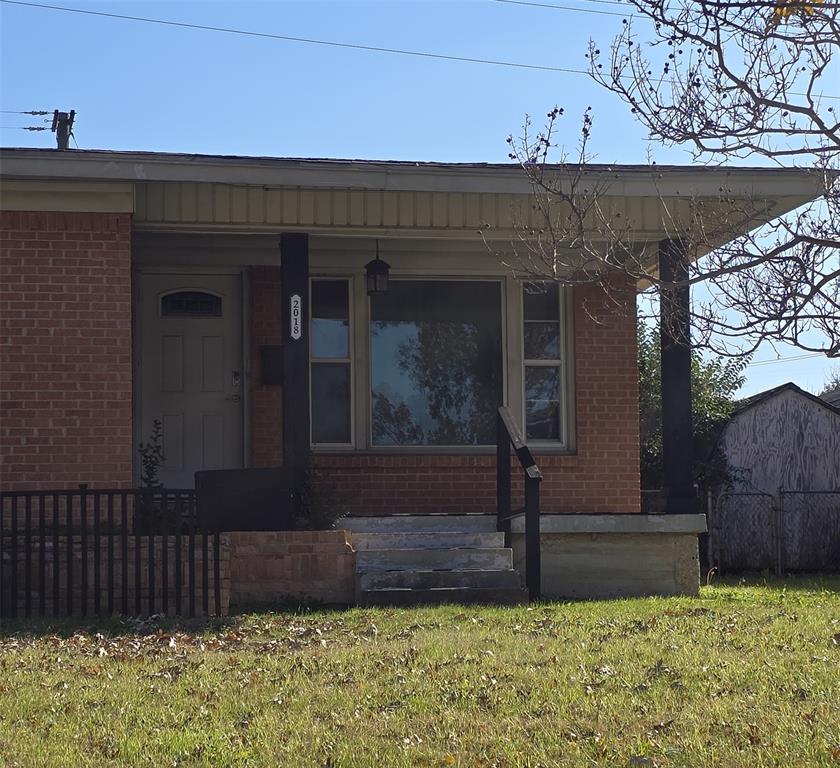 2018 Van Cleave Drive Dallas, TX 75216 - Photo 2 of 12 a front view of a house with garden