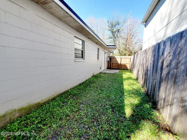 a backyard of a house with lots of green space