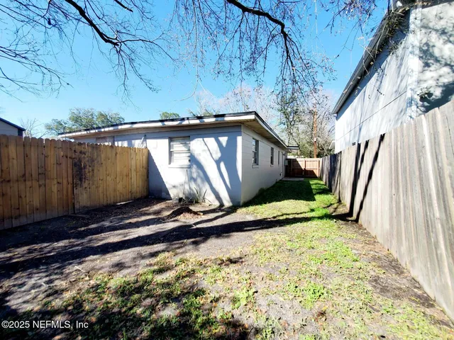 a view of outdoor space with wooden floor and a sink