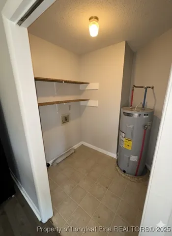 a view of a utility room with wooden floor