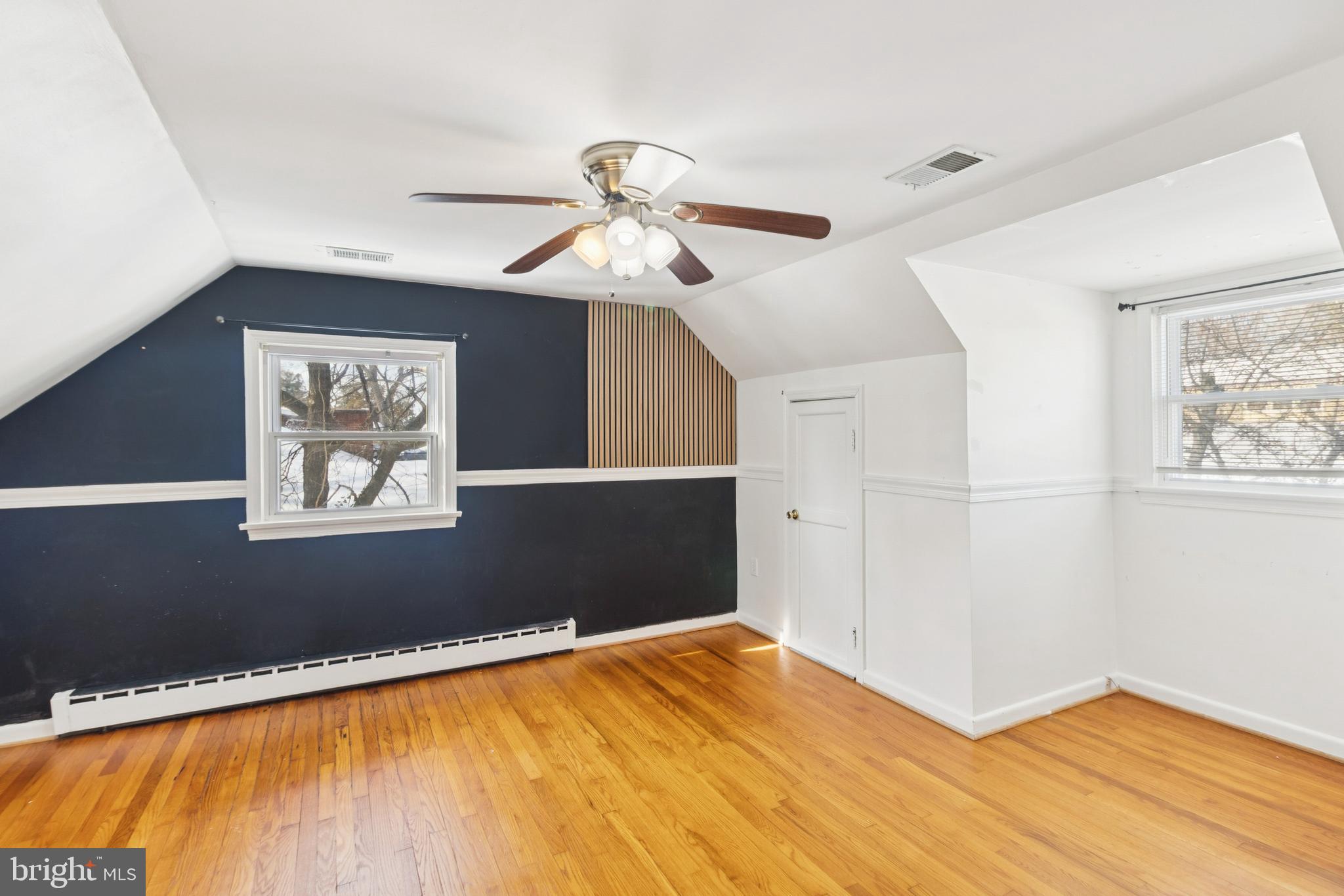 305 Cedar Ridge Drive Oxon Hill, MD 20745 - Photo 12 of 22 a view of a big room with wooden floor and windows