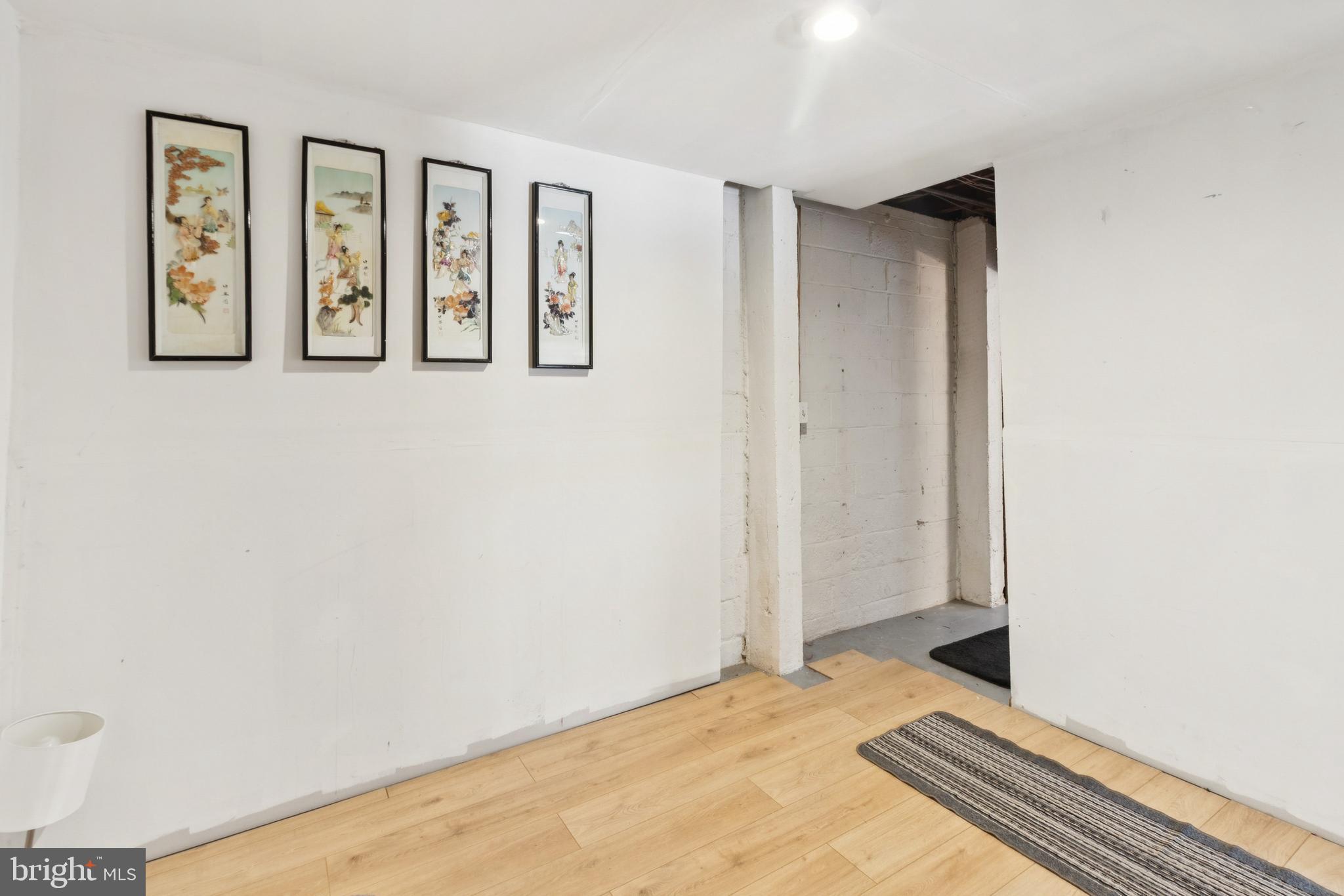 305 Cedar Ridge Drive Oxon Hill, MD 20745 - Photo 16 of 22 a view of a bedroom with wooden floor and window