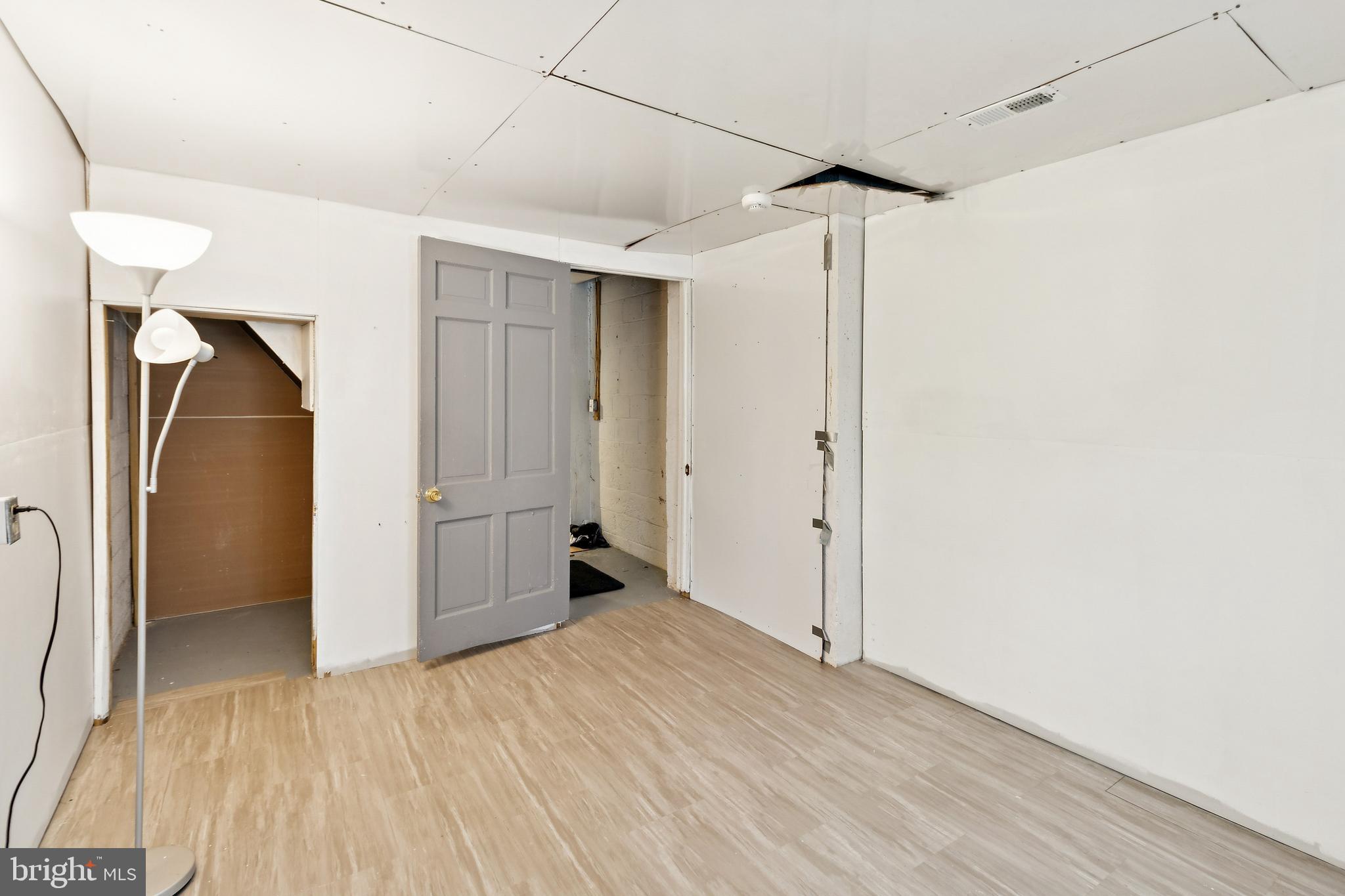 305 Cedar Ridge Drive Oxon Hill, MD 20745 - Photo 17 of 22 a view of empty room with wooden floor and cabinet