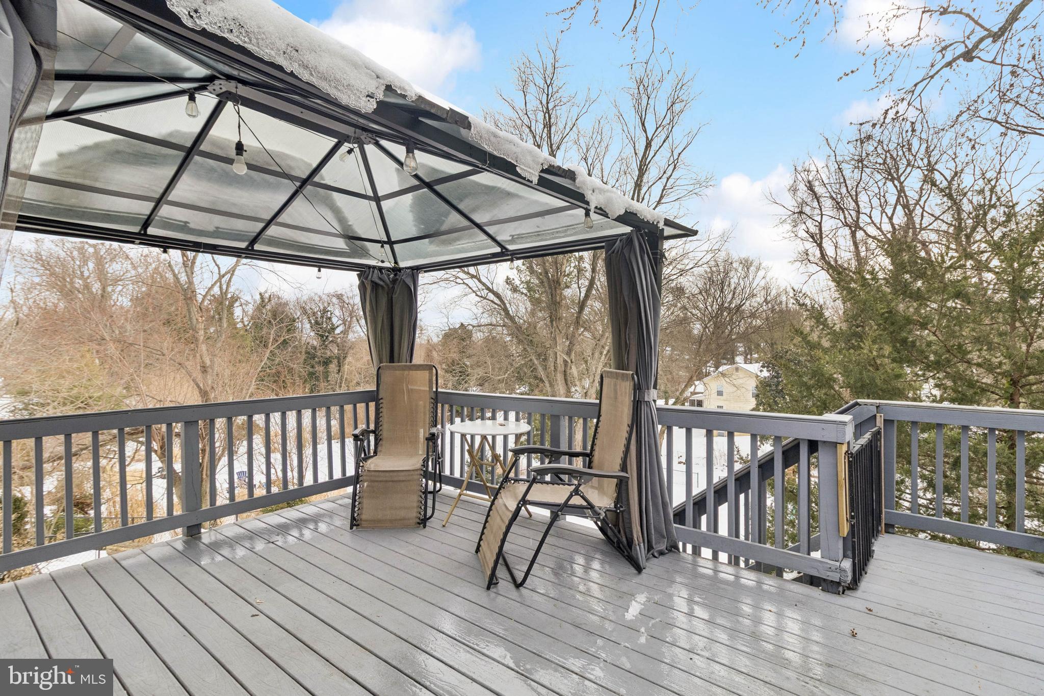 305 Cedar Ridge Drive Oxon Hill, MD 20745 - Photo 22 of 22 a view of balcony with wooden floor and seating space