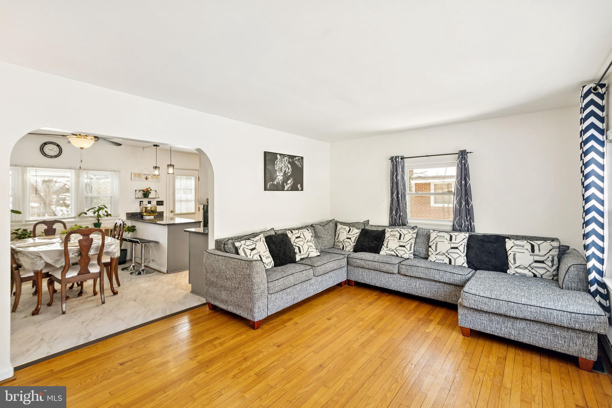 305 Cedar Ridge Drive Oxon Hill, MD 20745 - Photo 4 of 22 a living room with furniture and a wooden floor