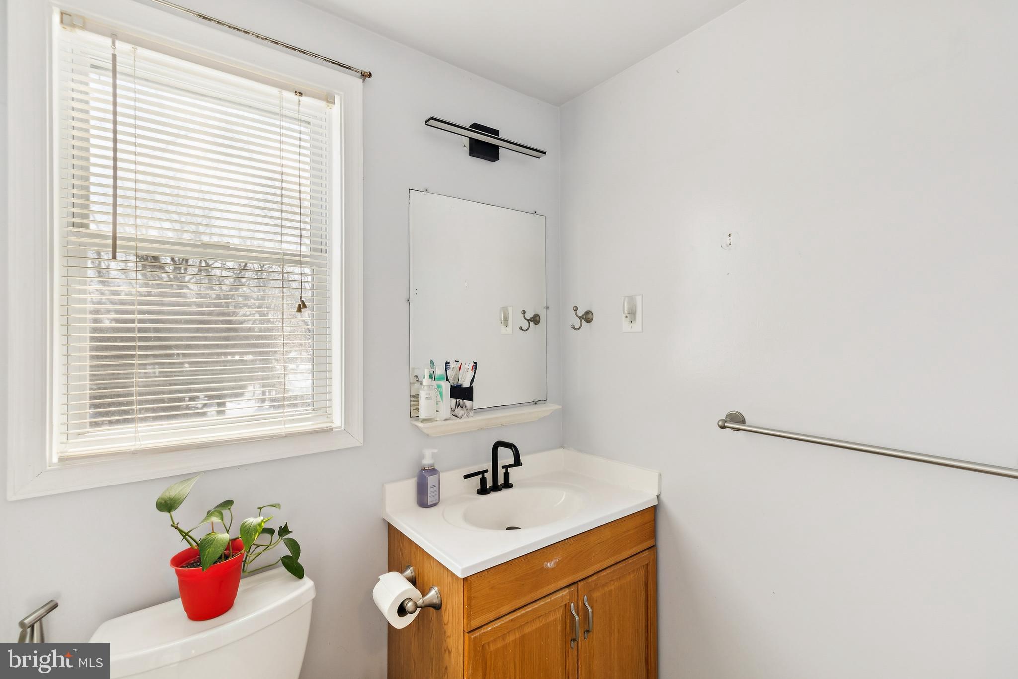305 Cedar Ridge Drive Oxon Hill, MD 20745 - Photo 8 of 22 a bathroom with a sink and a window