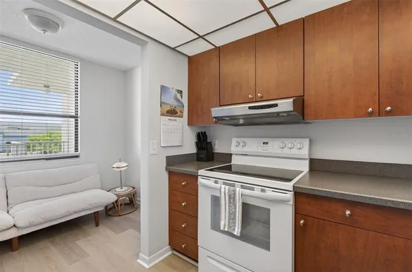 a kitchen with a stove and a microwave