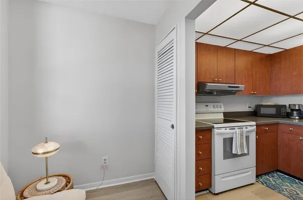 a kitchen with a stove and a microwave